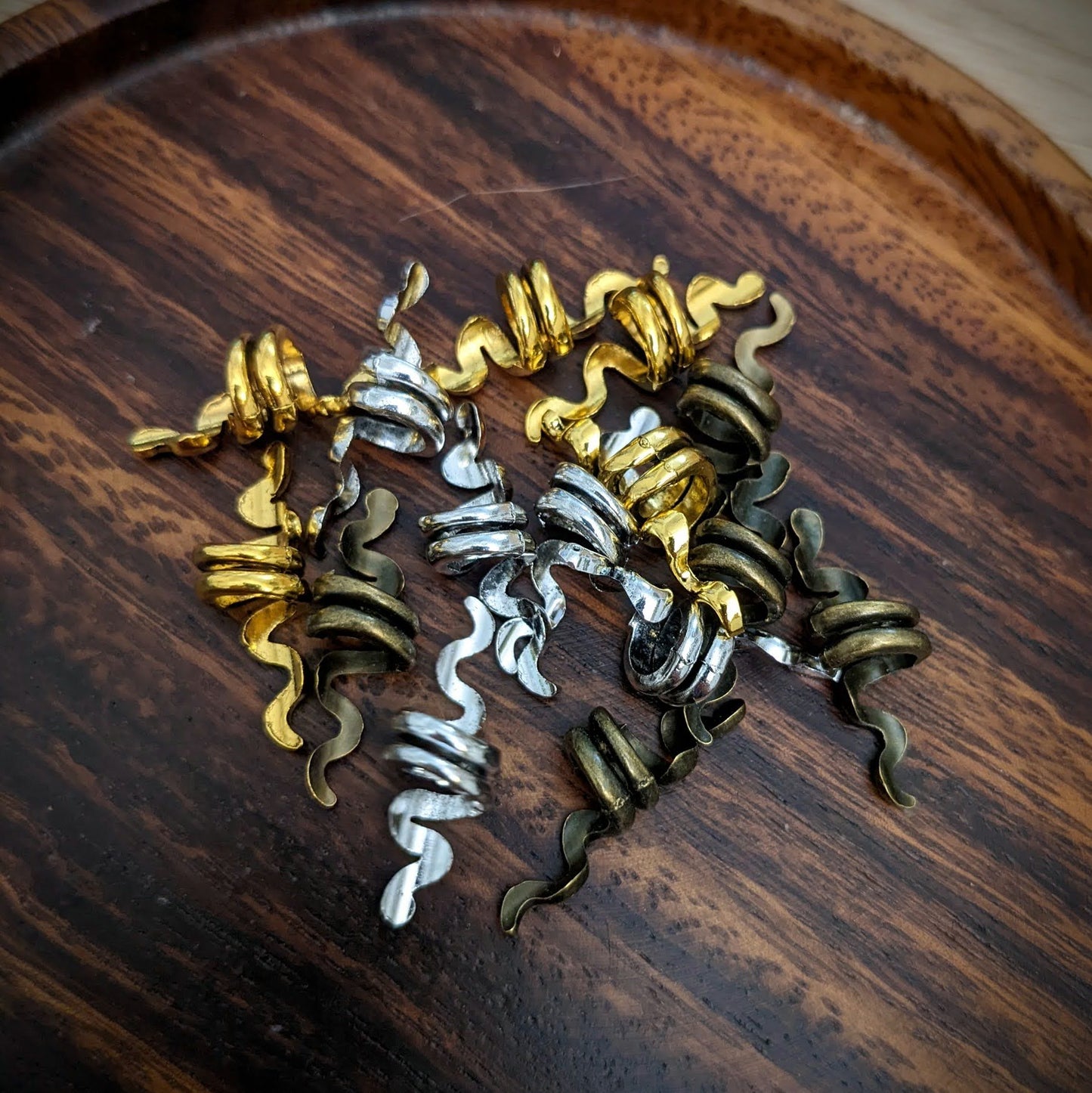 Small metal snake beads