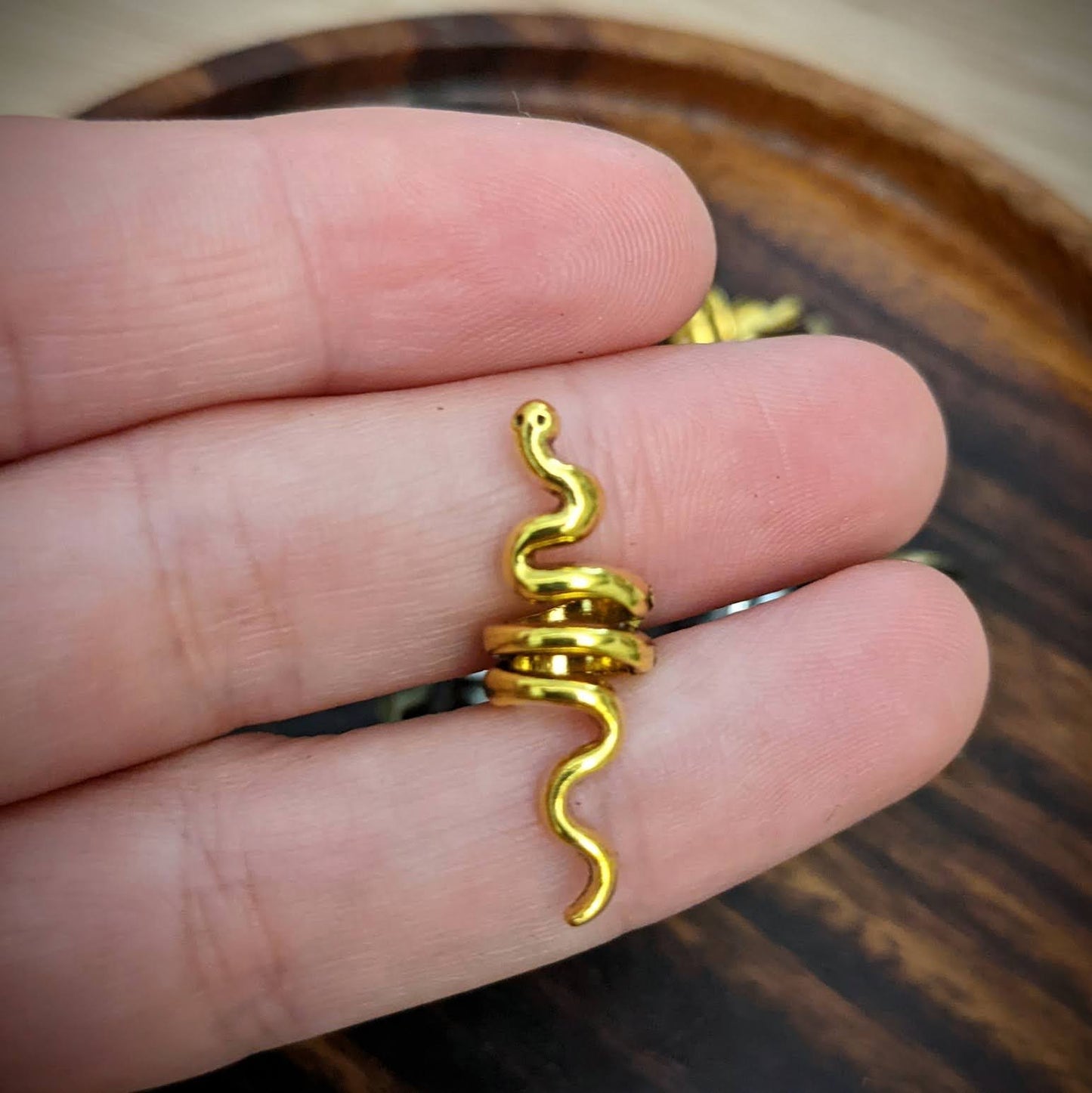 Small metal snake beads