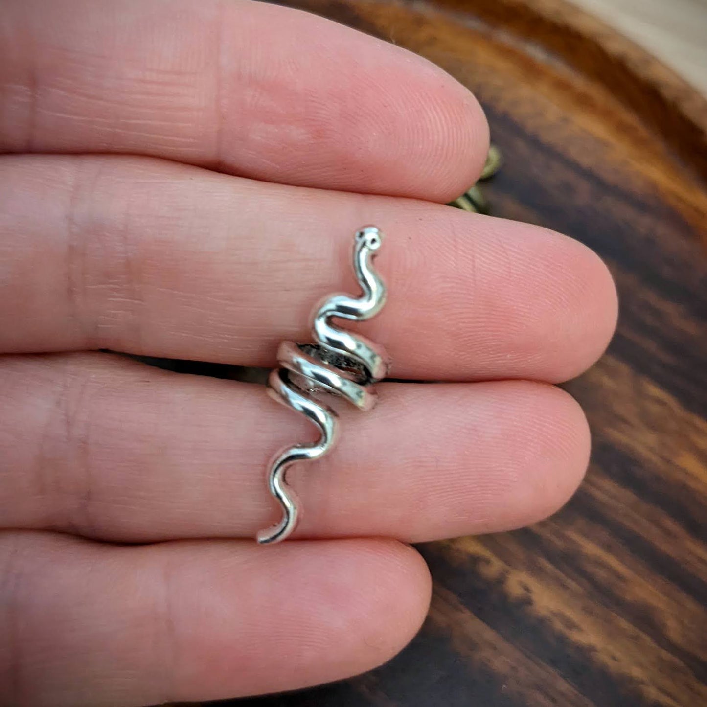 Small metal snake beads