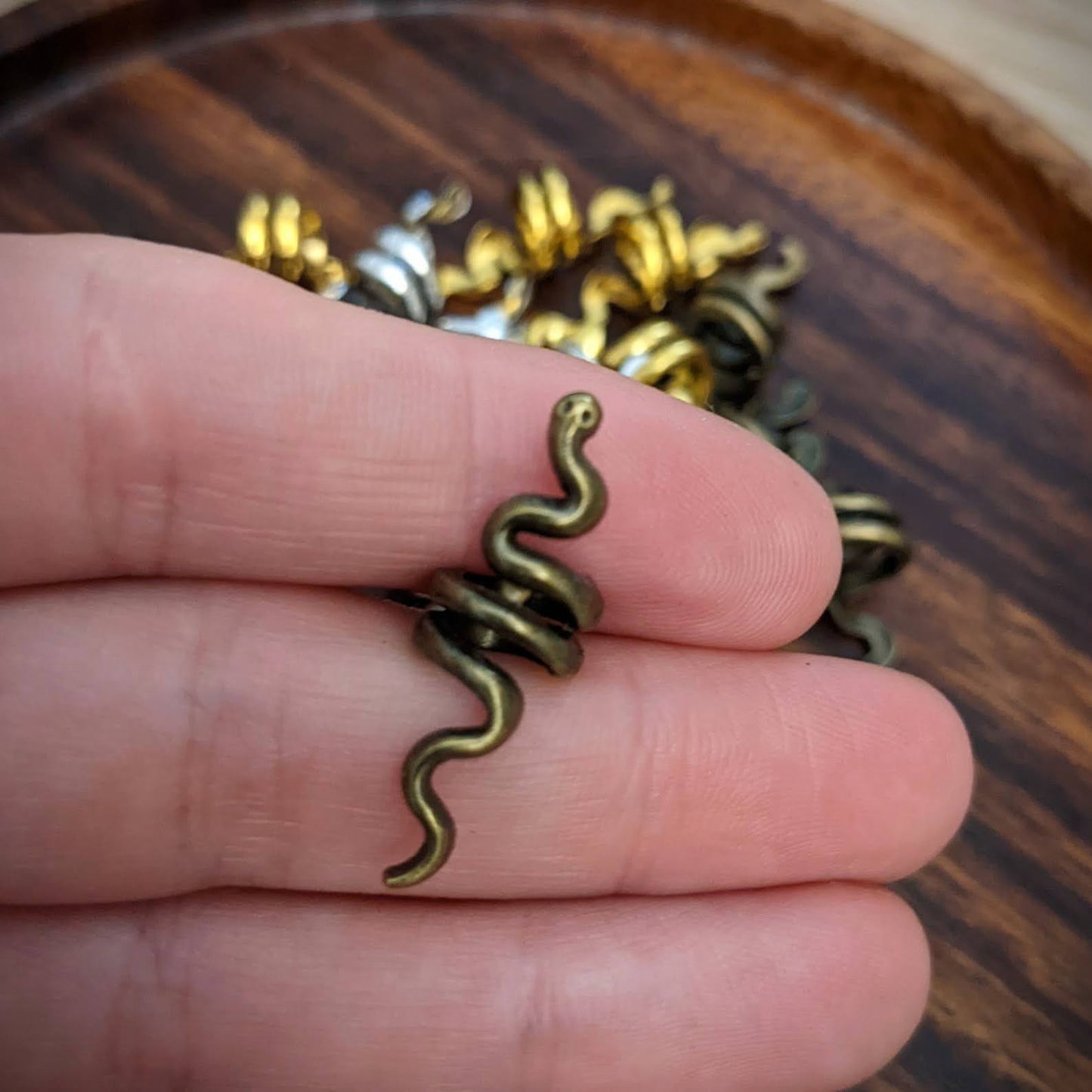 Small metal snake beads