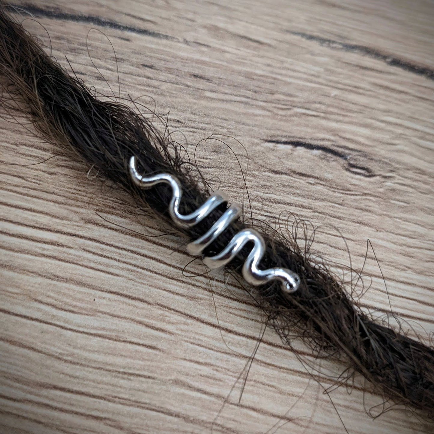 Small metal snake beads
