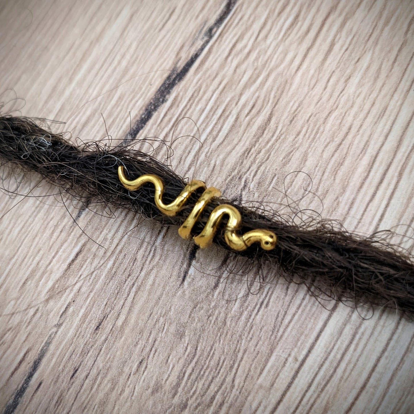 Small metal snake beads
