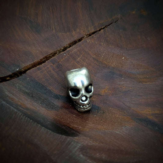 Metal skull beads