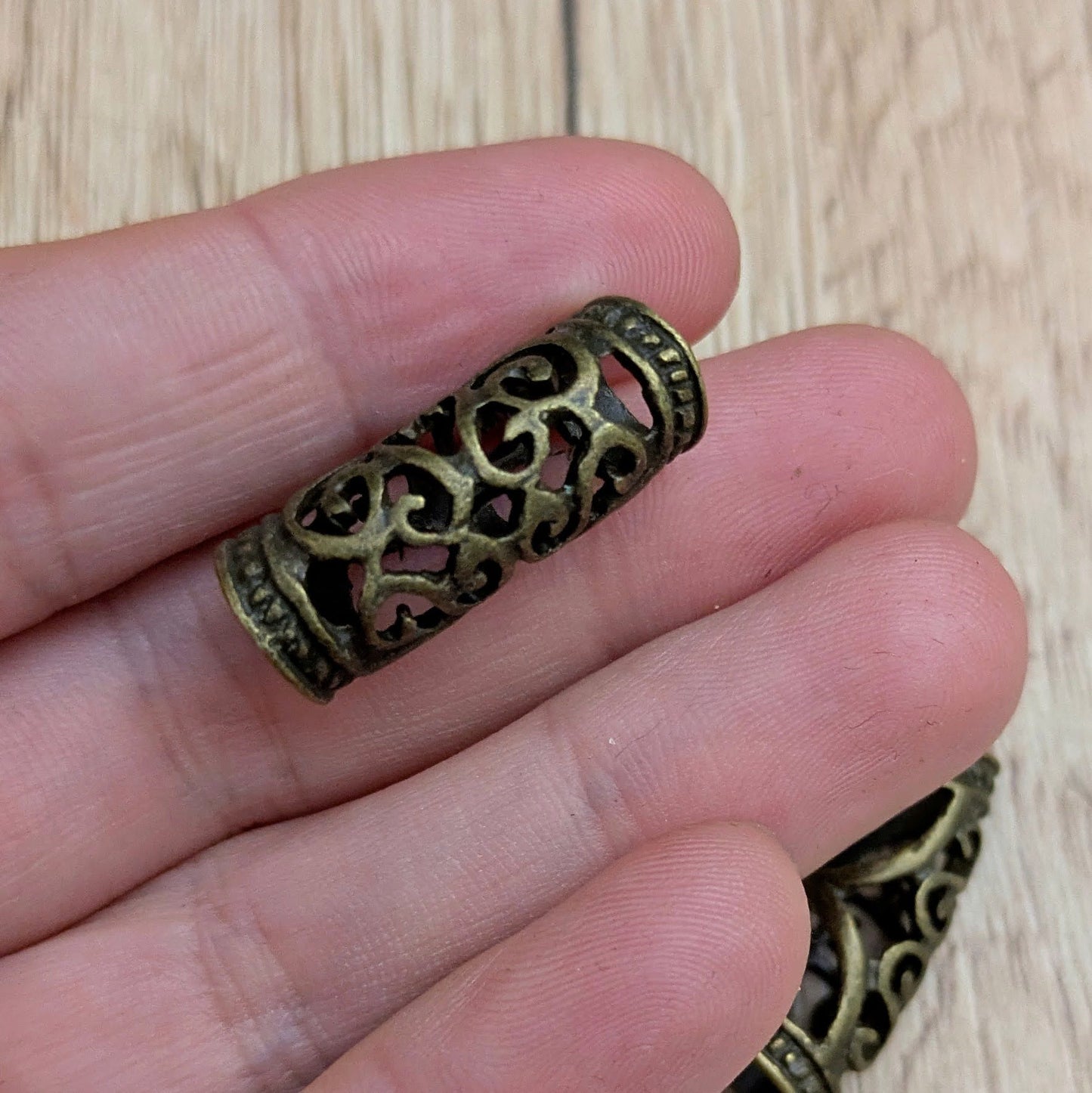 Metal beads with ornament (brass)