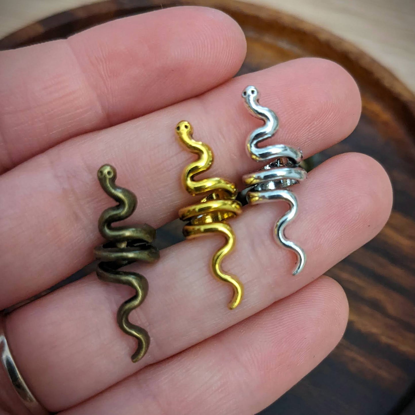 Small metal snake beads